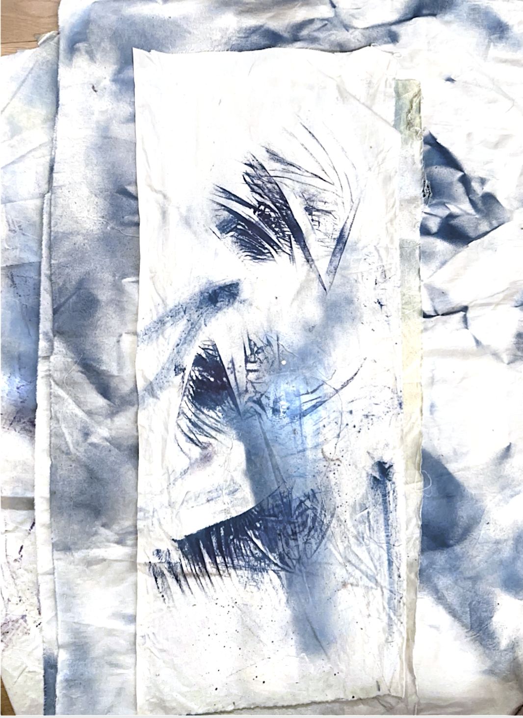 Blue ink worked into layered fabric